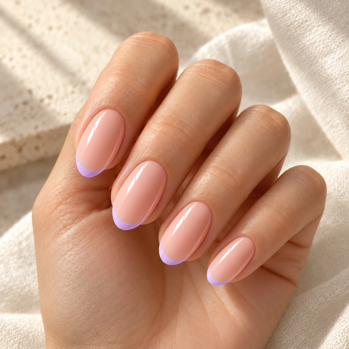 AI illustration of short nude almond nails with lilac French tips on a relaxed hand