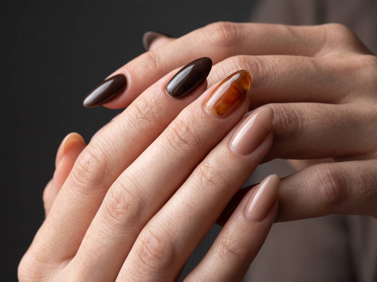 Illustrative manicure with a curved glossy finish